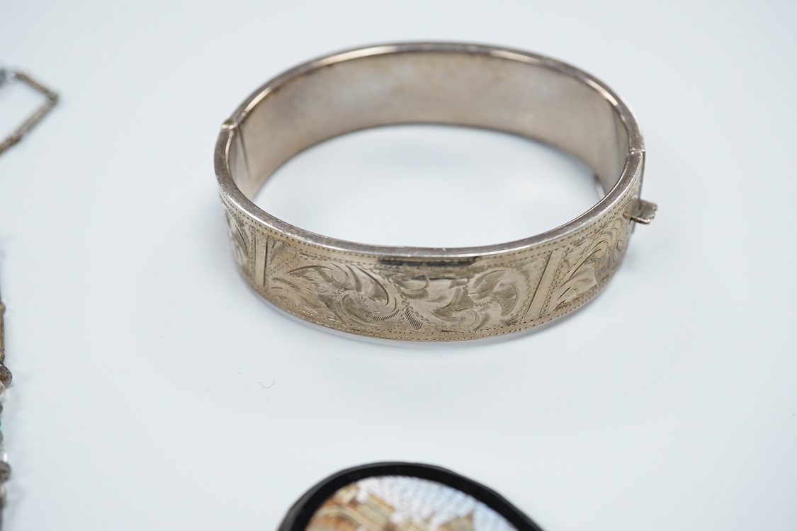 A group of mainly antique jewellery including micro-mosaic plaque, a pair of 9ct and coral drop earrings, a silver bangle, a George V enamel and silver brooch(a.f.) etc.